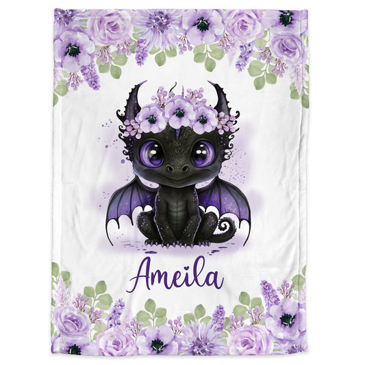 Close up of  personalized baby blanket with cute black dragon with purple flowers.