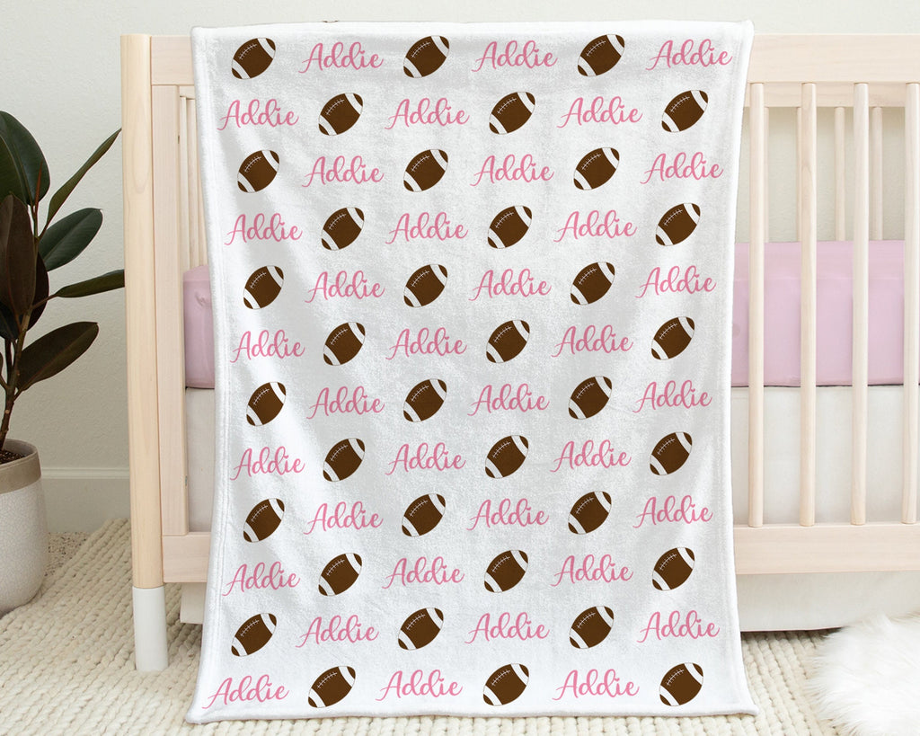 Pink football blanket, personalized newborn girls blanket with name, sports ball baby gift, swaddle blanket with footballs, any team colors