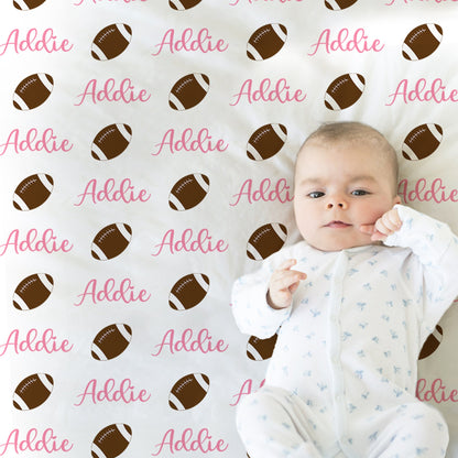 Pink football blanket, personalized newborn girls blanket with name, sports ball baby gift, swaddle blanket with footballs, any team colors